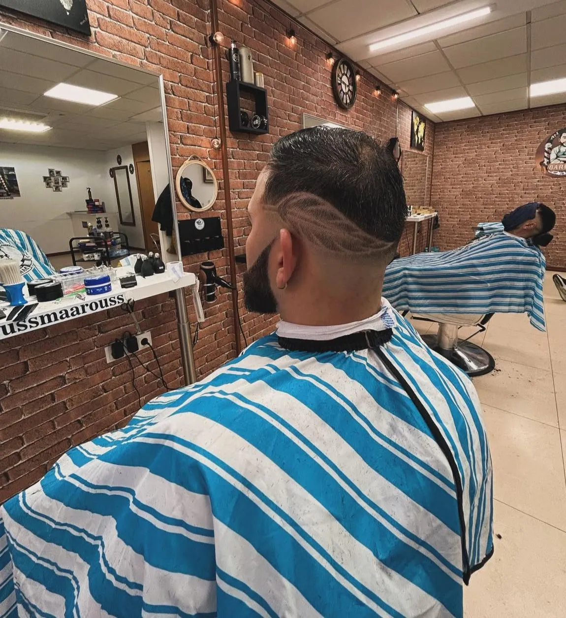 Corte degradado y diseño de barba en Peluquería Anwar Tarragona